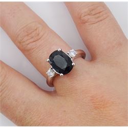 18ct white gold sapphire and diamond three stone ring, single oval cut sapphire of approx 3.00 carat, with a round brilliant cut diamond set either side, hallmarked, total diamond weight approx 0.25 carat
