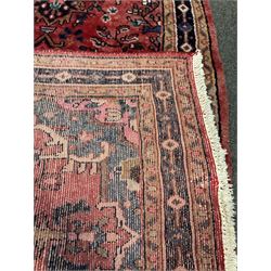 Persian red ground runner, central medallion, floral field, repeating boarder 