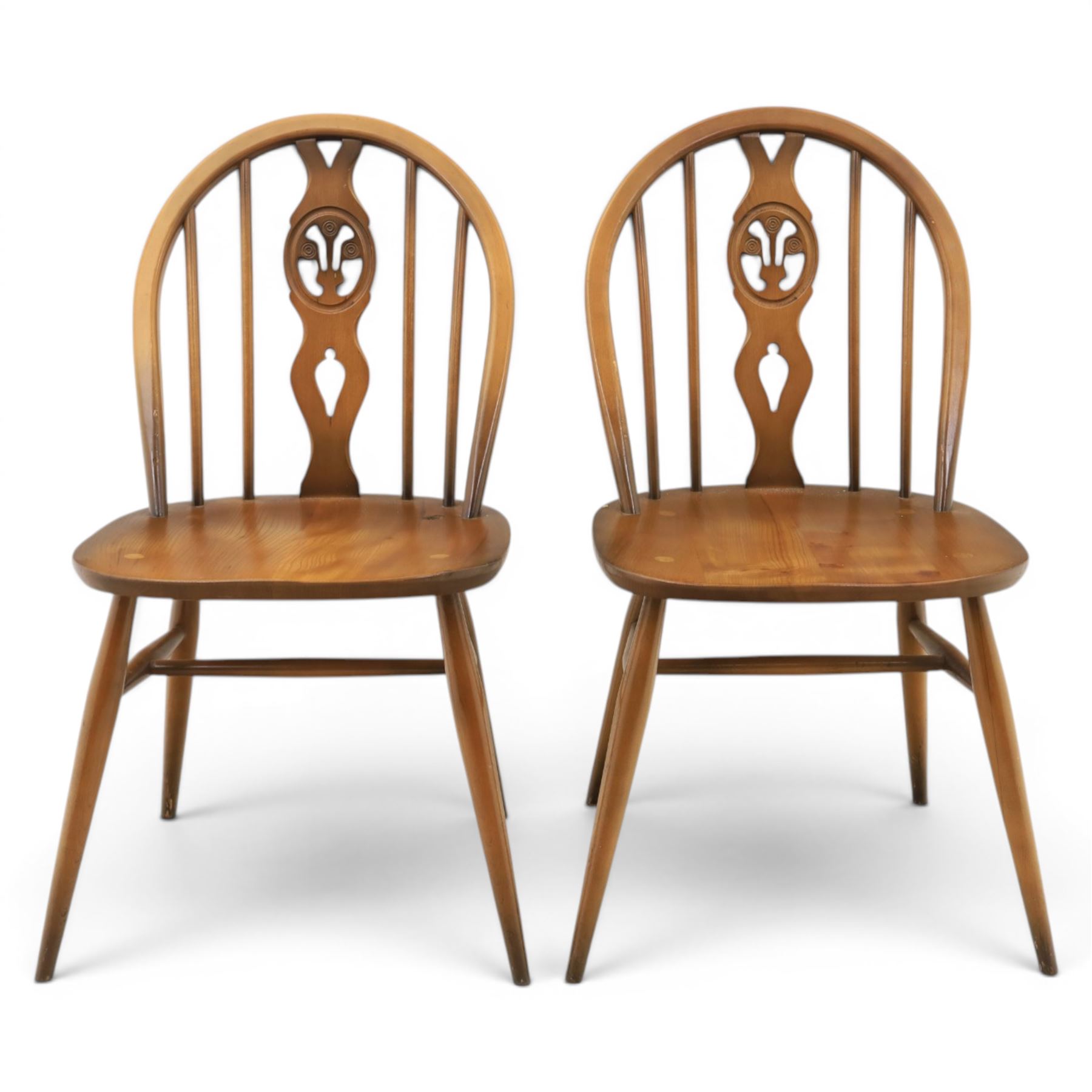Ercol - Set of four dark elm 'Fleur De Lys' chairs