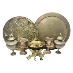 Collection of oriental brass and other metal ware, to include to large chargers, pair of covered urns, hoho bird, etc, largest charger D63cm