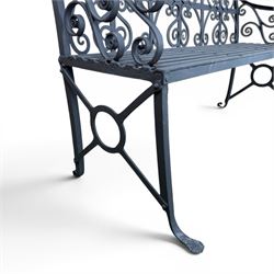 Regency period wrought iron garden bench, hand forged in wrought iron and finished in matt black paint, decorated with intricate scrollwork and featuring circular geometric ends, strapwork seat