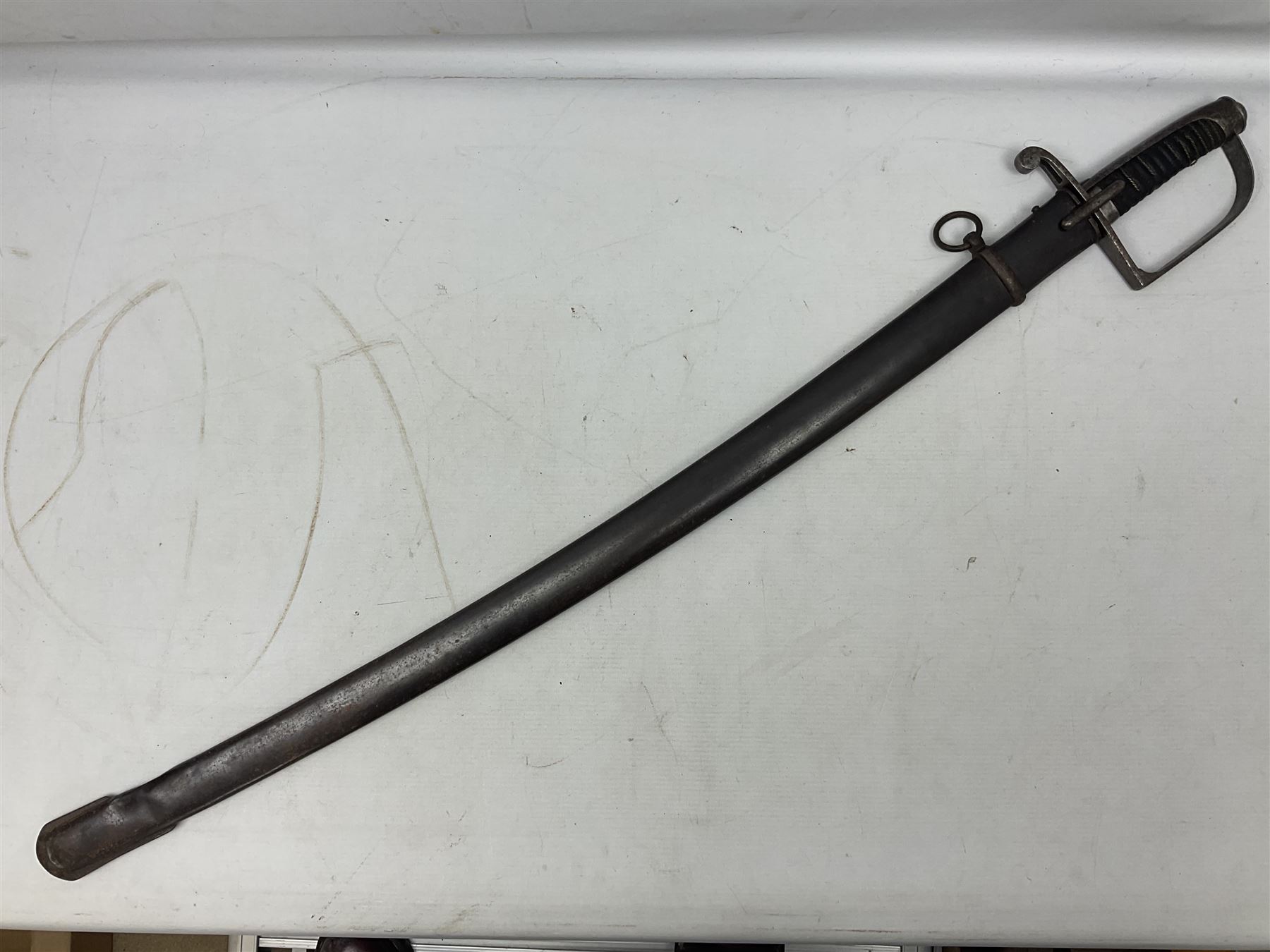 Italian M1833 Sabre with slightly curving 79cm fullered steel blade, the plain steel hilt with 'D' shaped knuckle bow, langets and wire-bound leather grip; in steel scabbard with single hanging ring L101cm overall