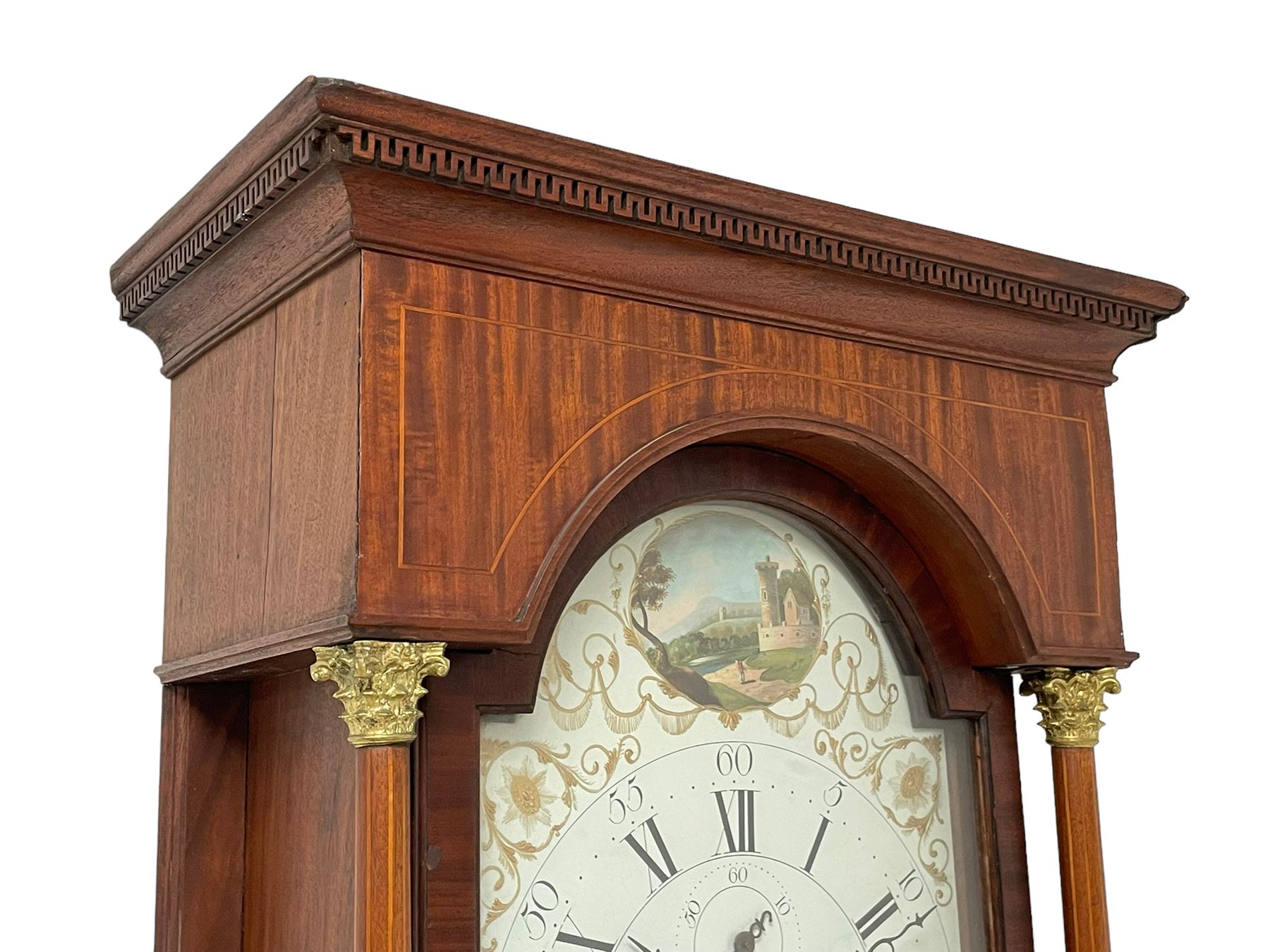 Thomas Greaves of Newcastle - late 18th century 8-day mahogany longcase clock c1790, with a flat topped hood and break arch hood door flanked by pilasters with Corinthian capitals, trunk with canted corners and ogee spire topped trunk door, rectangular plinth on a decorative stepped base,  early painted dial with raised gesso spandrels and a painted oval landscape to the arch, with matching steel hands, Roman numerals, five minute Arabic's and minute markers, subsidiary seconds dial and calendar aperture,  dial pinned via a cast falseplate to a rack striking movement with a recoil anchor escapement, striking the hours on a bell. With pendulum and weights.