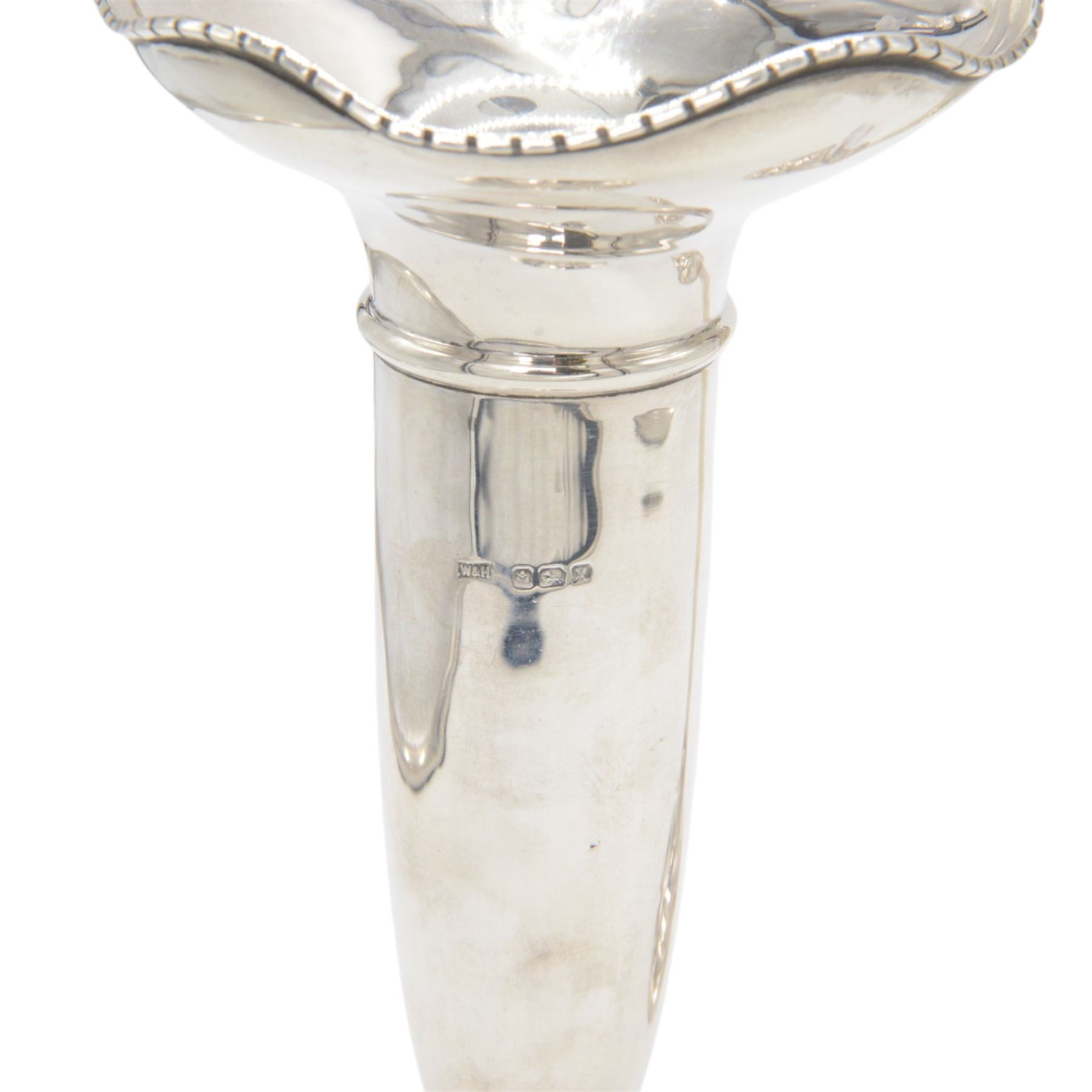 Two 1920s silver mounted trumpet vases, the first example of faceted form, hallmarked James Deakin & Sons, Sheffield 1921, the second example with fluted rim, hallmarked Walker & Hall, Birmingham 1922, tallest H25cm