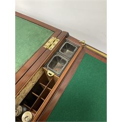 Mahogany brass bounded campaign style writing box, the hinged lid lifting to reveal the green felted folding writing slope and fitted compartmented interior, with glass bottles, inkwells etc, with key