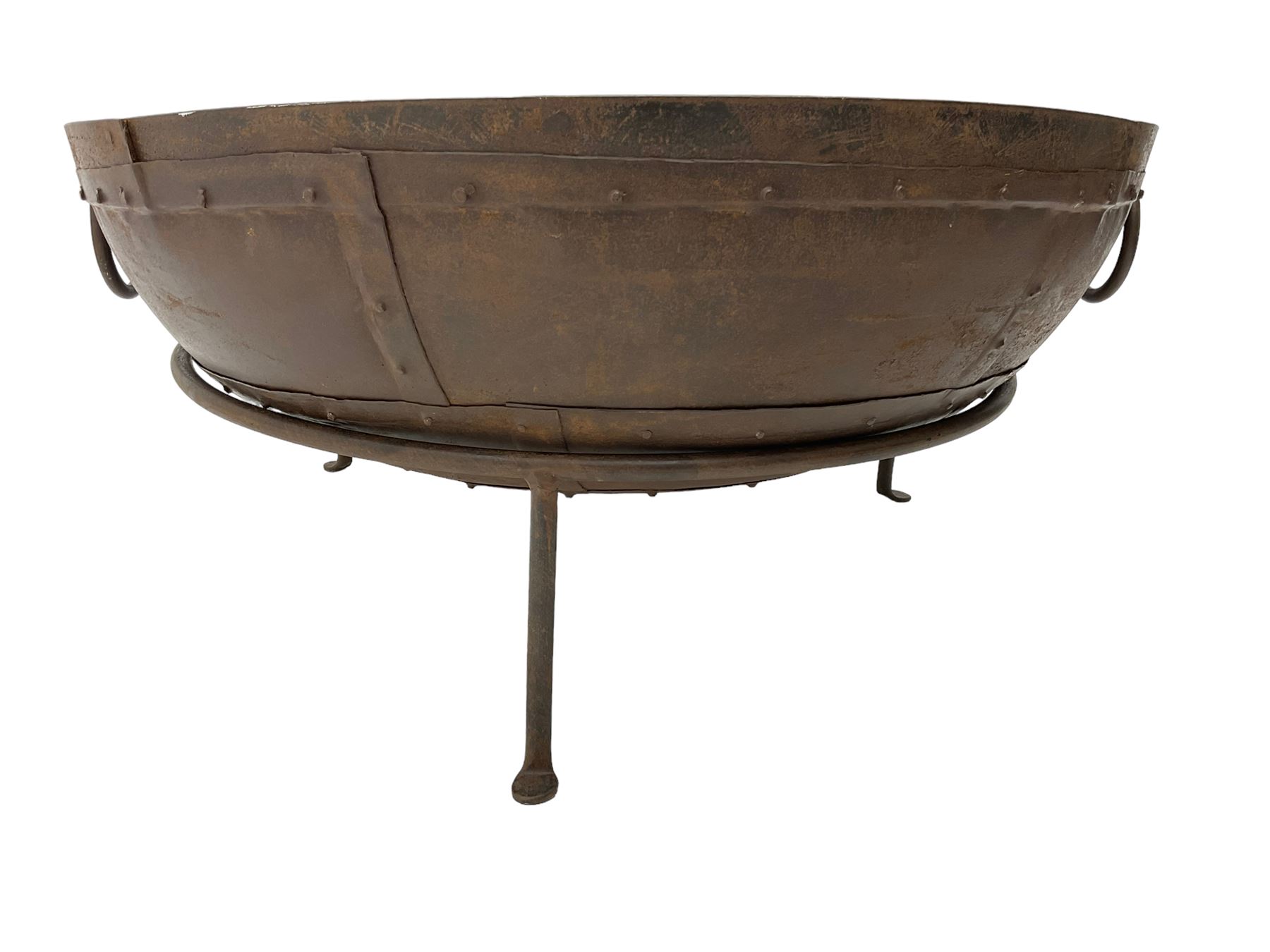 Circular riveted iron fire pit, strapwork sides with twin handles on stand, with grate