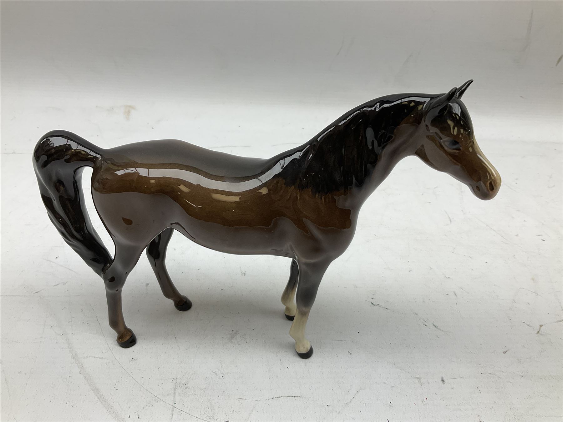 Seven Beswick figures of horses, including Connemara pony in grey no.1641, Arab in bay no.1265, large foal in grey no.947 etc, together with a Goebel figure of a horse (8)