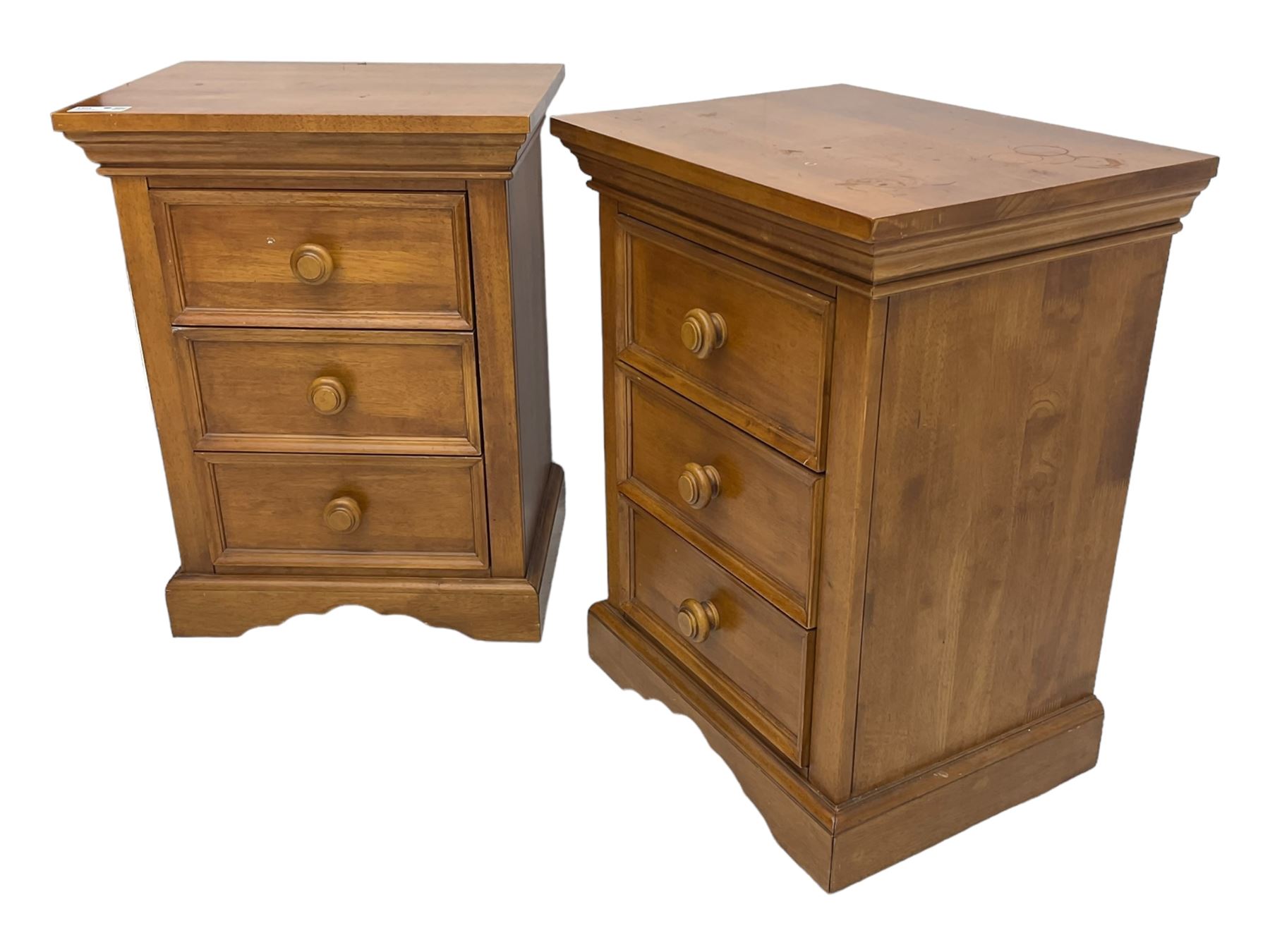 Pair of contemporary cherry wood bedside chests, rectangular top and projecting moulded cornice over three drawers, on plinth base with shaped apron