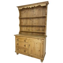 Early 20th century and later pitch pine farmhouse dresser,three-tier plate rack over three drawers and single cupboard, on turned feet
