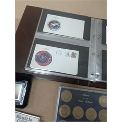 Nasa Space Shuttle program commemorative items, including album of stamp covers, telephone cards, five Shuttle Crew Emblem Collector's Series medallions, Maiden Flights bronze medallions, Missions of the Orbiter Challenger set of medallions and Apollo series medallions