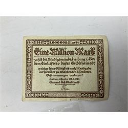 WW2 German War Pass (Wehrpass) identification paperwork for Walter Fensterseifer 2nd type booklet dated 8/6/1940, with signed photo of recipient in civilian suit. Born 31st January 1921. Numerous entries; together with quantity of small private photographs of German soldiers; One Million mark banknote 1923; 30th Corps in Germany booklet with Formation badge; and other WW2 paper ephemera