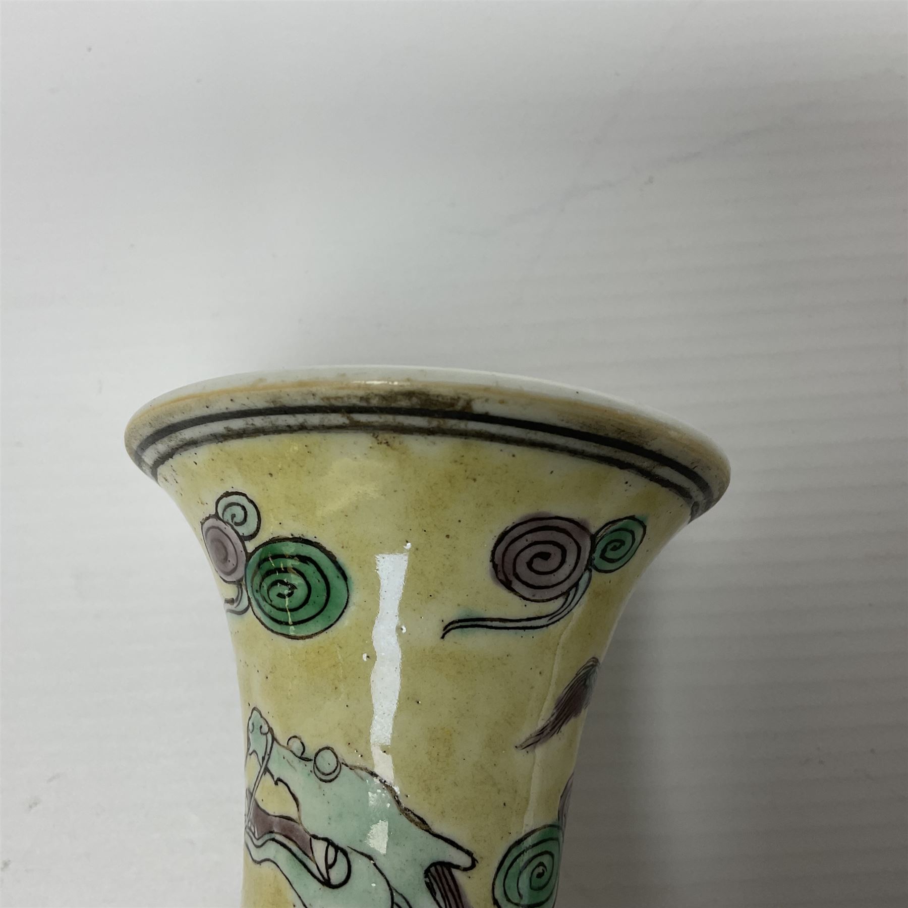 20th century Chinese Famille Verte vase, of slender ovoid form with tapering neck and flared rim, decorated with green and grey enamel with dragons chasing flaming pearls amongst auspicious clouds upon a yellow ground, H30cm