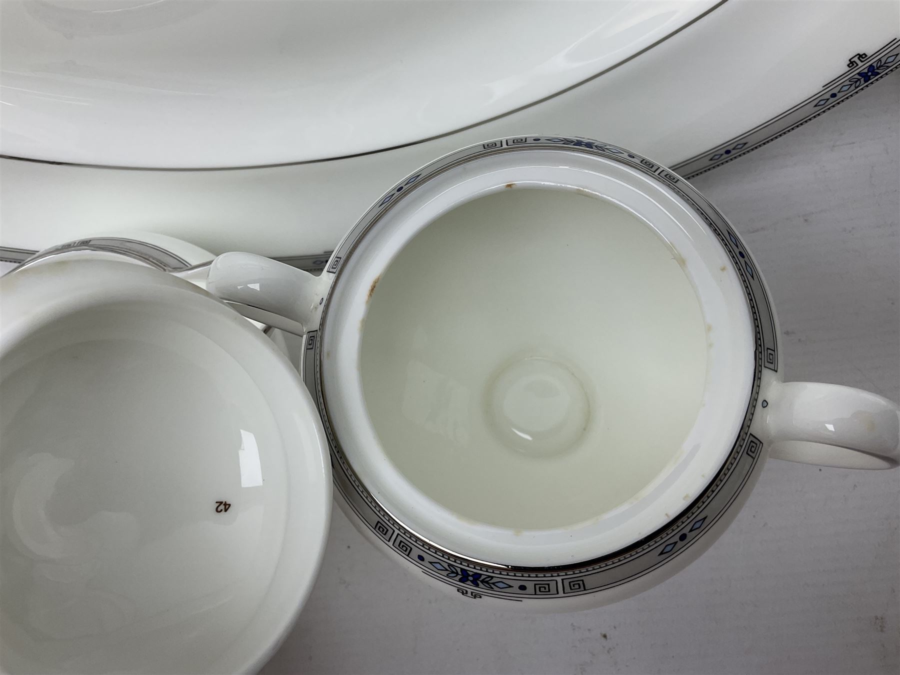 Wedgwood Amherst pattern part tea service, comprising eight cups and saucer, sixteen dessert plates, milk jug, covered sucrier, together with matching platter and two open serving dishes