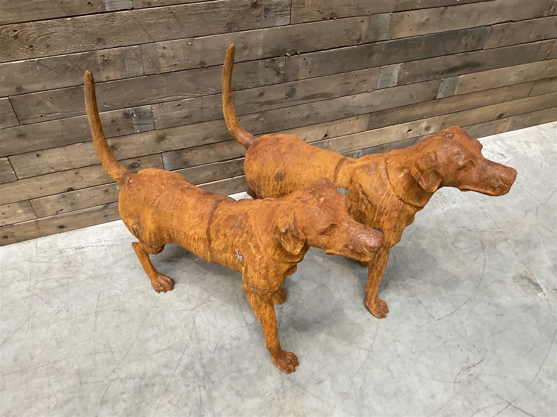 Pair of life-size heavy cast iron garden Hunting dogs