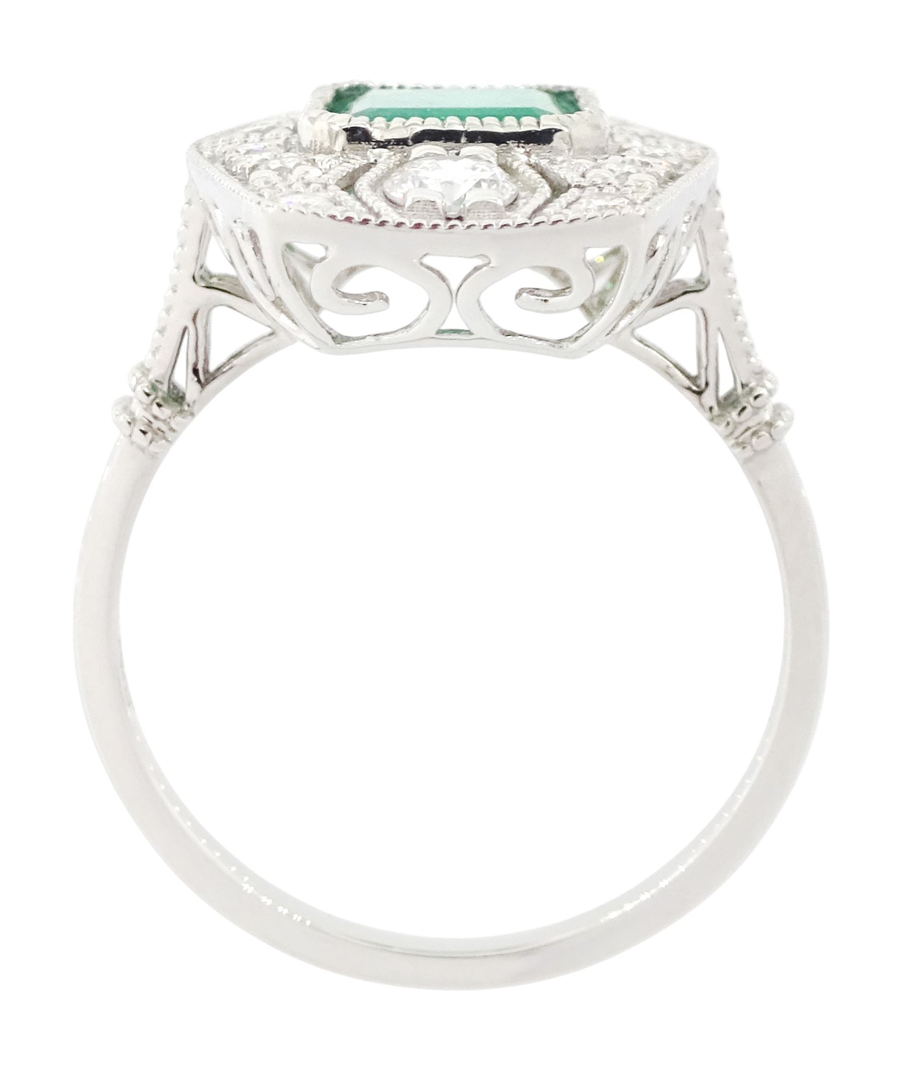 Platinum emerald and diamond dress ring, milgrain set with a single octagonal cut emerald of 1.26 carat, surrounded by round brilliant cut diamonds in an pierced design setting, stamped PT 950, total diamond weight 0.47 carat