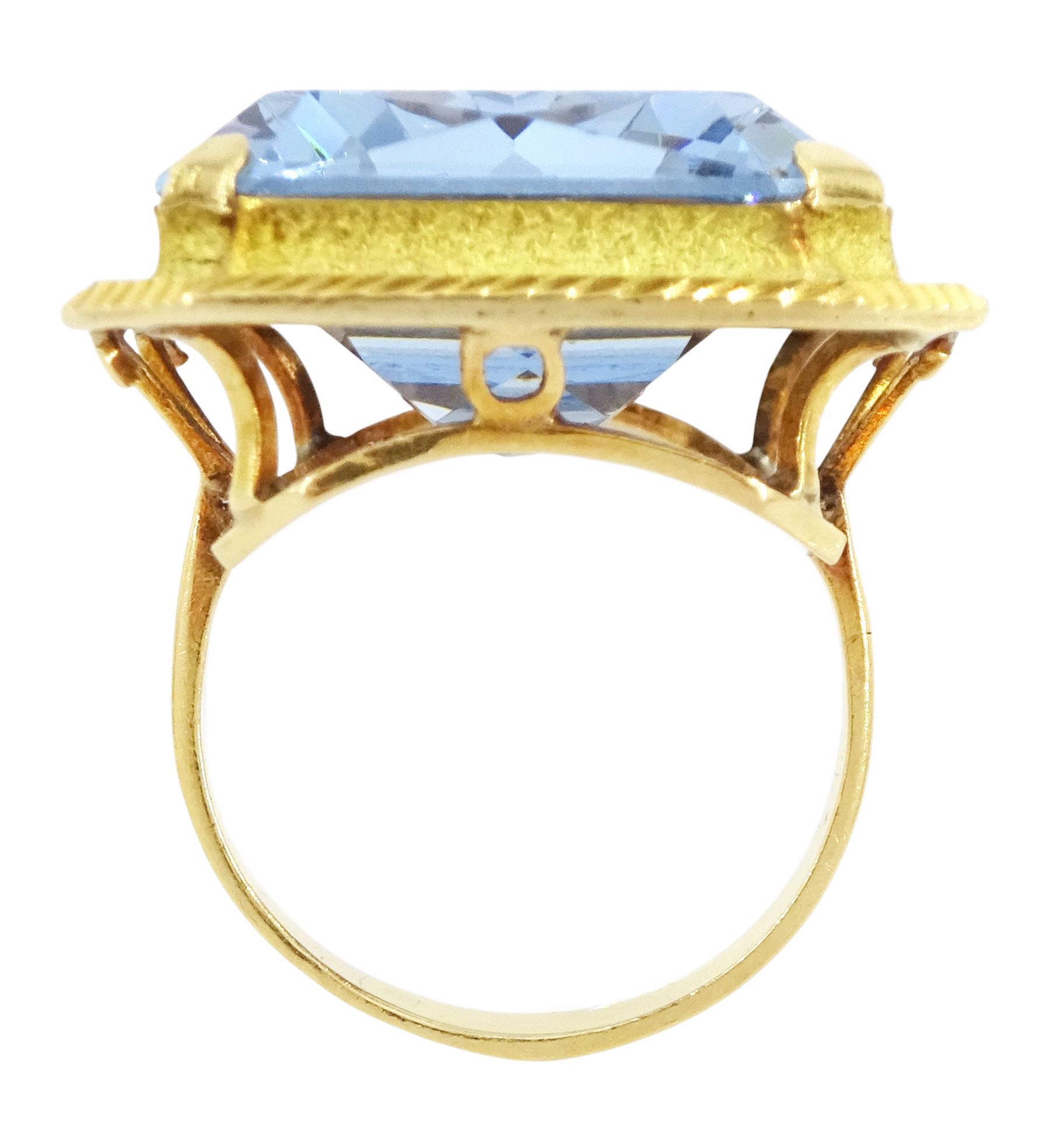 Gold synthetic spinel ring, single octagonal cut synthetic spinel with textured and engraved border