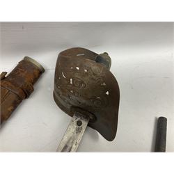 George V 1897 pattern Infantry officers sword, the 82cm single fullered blade with traces of etched detail and George V crown cipher, the ricasso marked Hawksworth Sheffield, pierced half basket hilt with George V cypher, wire-bound fish-skin grip with brass pommel and backstrap; in leather scabbard L102cm overall; together with two sectional gun cleaning rods; swagger stick made of leather strips etc