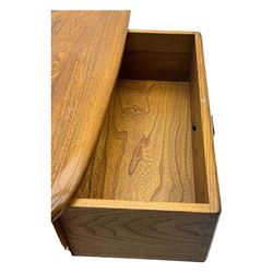 Lucian Ercolani for Ercol - elm 'Pandora's Box' coffee table, square top with rounded corners over two drawers with sculpted recessed pulls, open sides supporting undertier, on castors 