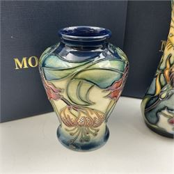 Two small Moorcroft vases, one decorated in the Anna Lily pattern by Nicola Slaney, circa 1998, H9cm and the other in the Prairie Summer pattern by Rachel Bishop, circa 2001, both with original boxes (2)