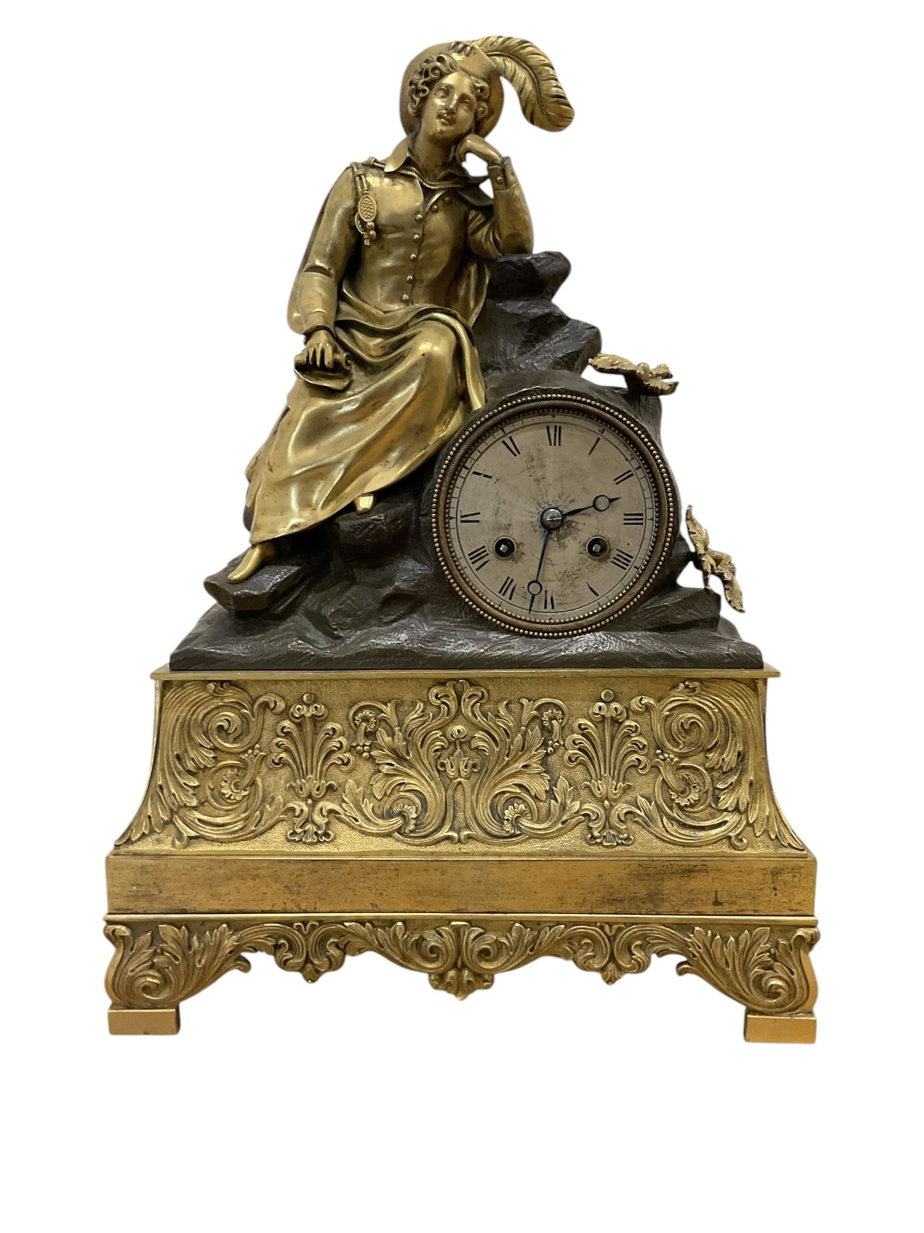 French-Louis XVIII  8-day mantle clock c1820, on a rectangular gilt metal base incorporating repeating cast leaf decoration on a pierced apron and bracket feet, surmounted with a cast brass figure depicting a reclining lady in 18th century dress, Parisian drum movement with a silk suspension and unglazed silvered dial, with Roman numerals and steel moon hands, dial pinned to a countwheel striking movement, sounding the hours and half-hours on a bell. With pendulum and key.
