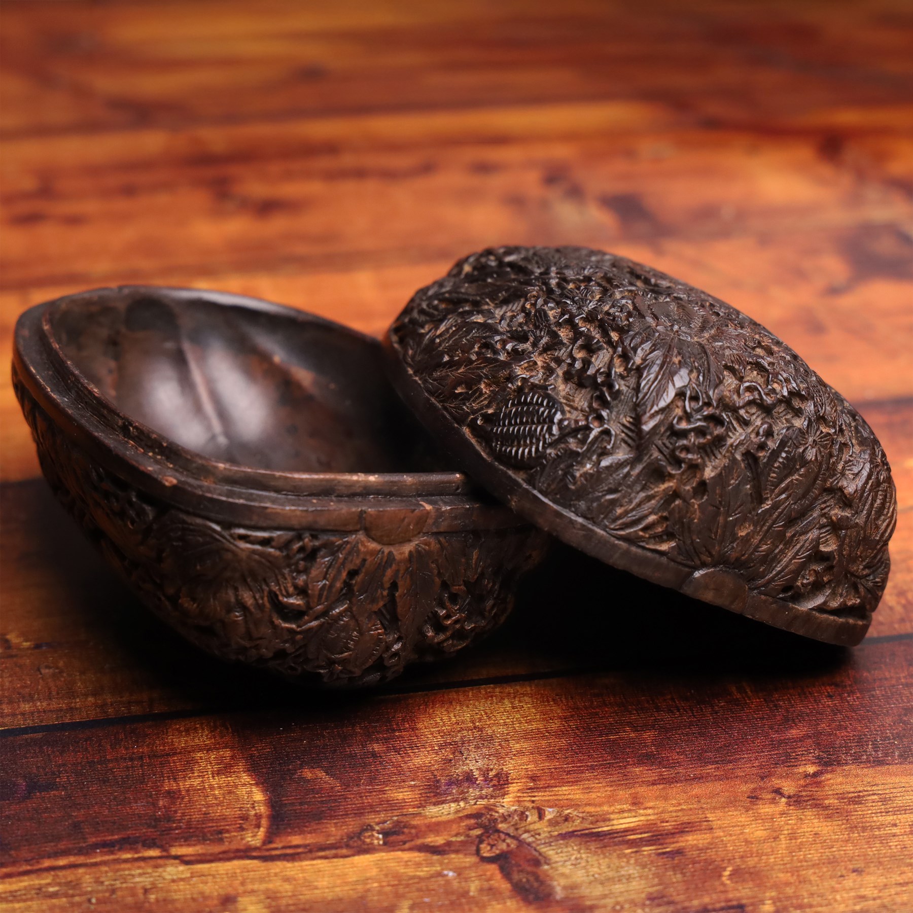 19th century Chinese cared nut/seed box, finely carved to the outside with foliate and animal motifs, L10cm, H8cm 