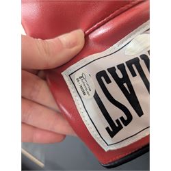 Large framed display containing two Everlast boxing gloves, one signed Muhammad Ali, displayed in frame with black and white photograph of Muhammad Ali speaking with Michael Parkinson, the signed glove has a Steiner authenticity hologram affixed and comes with certificate of authenticity from Steiner Sporting Memorabilia, frame H73cm