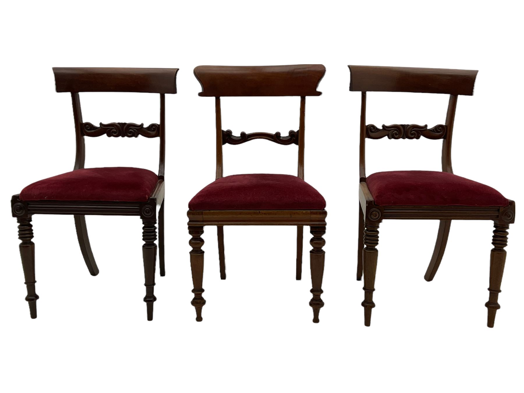 Seven early 19th century mahogany dining chairs - set six side chairs with scroll carved middle rails (W46cm), and a carver elbow chair with rope twist middle rail
