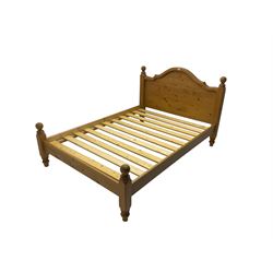Solid pine double bedstead, shaped headboard with flanking finials 