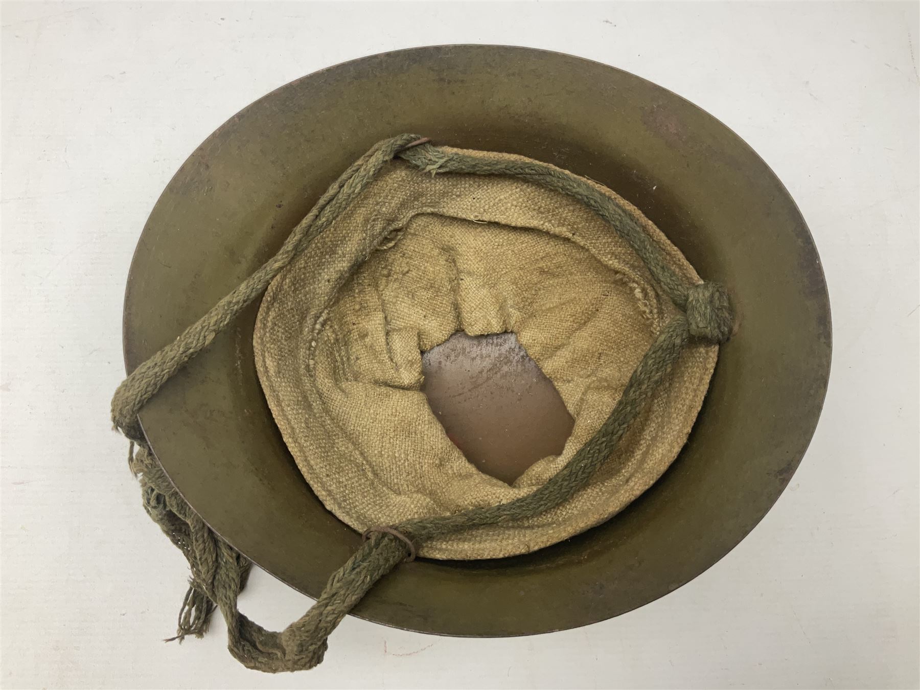 WW2 Japanese Army type 92 steel helmet with infantry star badge to centre, webbing liner and chin strap