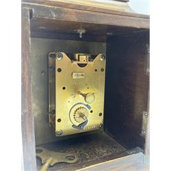 Small late 20th century walnut cased bracket clock. sarcophagus top with brass loop handle, brass dial with silvered Roman chapter ring and ornate spandrels, single train movement by 'Buren'