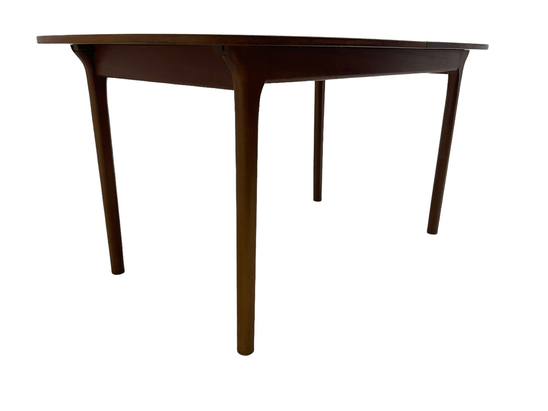 AH McIntosh & Co of Kirkaldy - mid-20th century teak extending dining table, rectangular top with rounded corners, concealed integrated double leaf, raised on tapered supports, 'Furniture by McIntosh sticker to underside of leaf