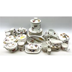 Royal Worcester Evesham pattern tea and dinner wares, to include dinner plates, salad plates, side plates, bowls, various serving dishes, sauce boat and stand, butter dish and cover, lidded jars, ramekins, teacups, milk jug, teapot, etc. 