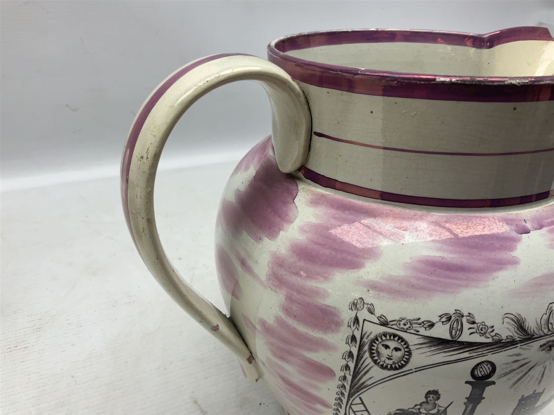 Early 20th century Sunderland lustre jug, decorated with transfer Masonic scene and poem 'The World is in Pain/Our Secrets to Gain/But Still Let Them Wonder and Gaze/The Never Can Divine/The World Nor The Sign/Of a Free and Accepted Mason', the reverse decorated with Sunderland River Wear cast iron bridge scene below text (a/f), together with a copper lustre jug, and pink lustre bowl, jug H20cm