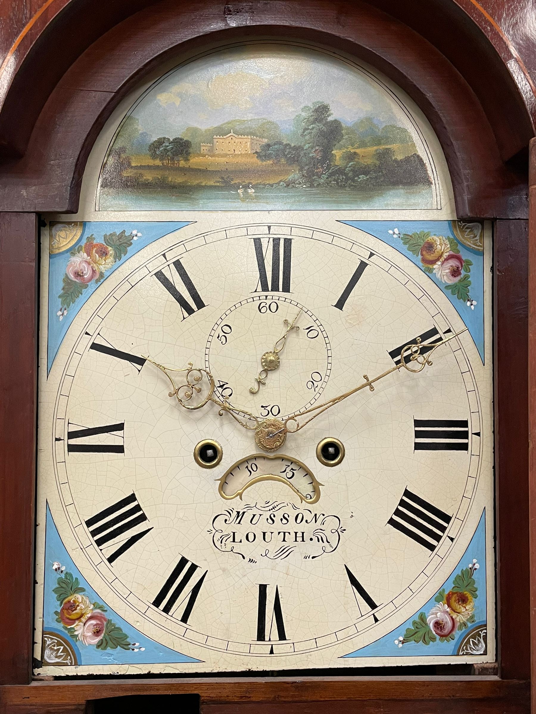 Musson of Louth - mid-19th century oak and mahogany 8-day longcase clock, with a swan’s neck pediment and ball and spire brass finial, break arch hood door flanked by reeded pilasters with brass capitals, canted angled trunk, flat topped door with concave corners, rectangular plinth on bracket feet, fully painted break arch dial with Roman numerals and minute track, subsidiary seconds dial and calendar aperture, matching stamped brass hands, eight day rack striking movement with anchor escapement. With weights and pendulum.
H206 W44 D23
Balthazar Musson from Baden (Germany) is recorded as working in Louth from 1835, naturalised 1861-8. Succeeded by his son, George Balthazar 1872-1920. 
