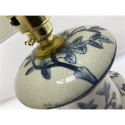 India Jane table lamp, decorated with blue birds and floral vines upon a white ground, fitted with a cream lampshade, H62cm 