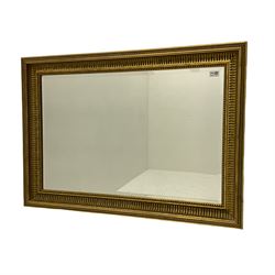 Heavy rectangular gilt framed wall mirror, bevelled glass