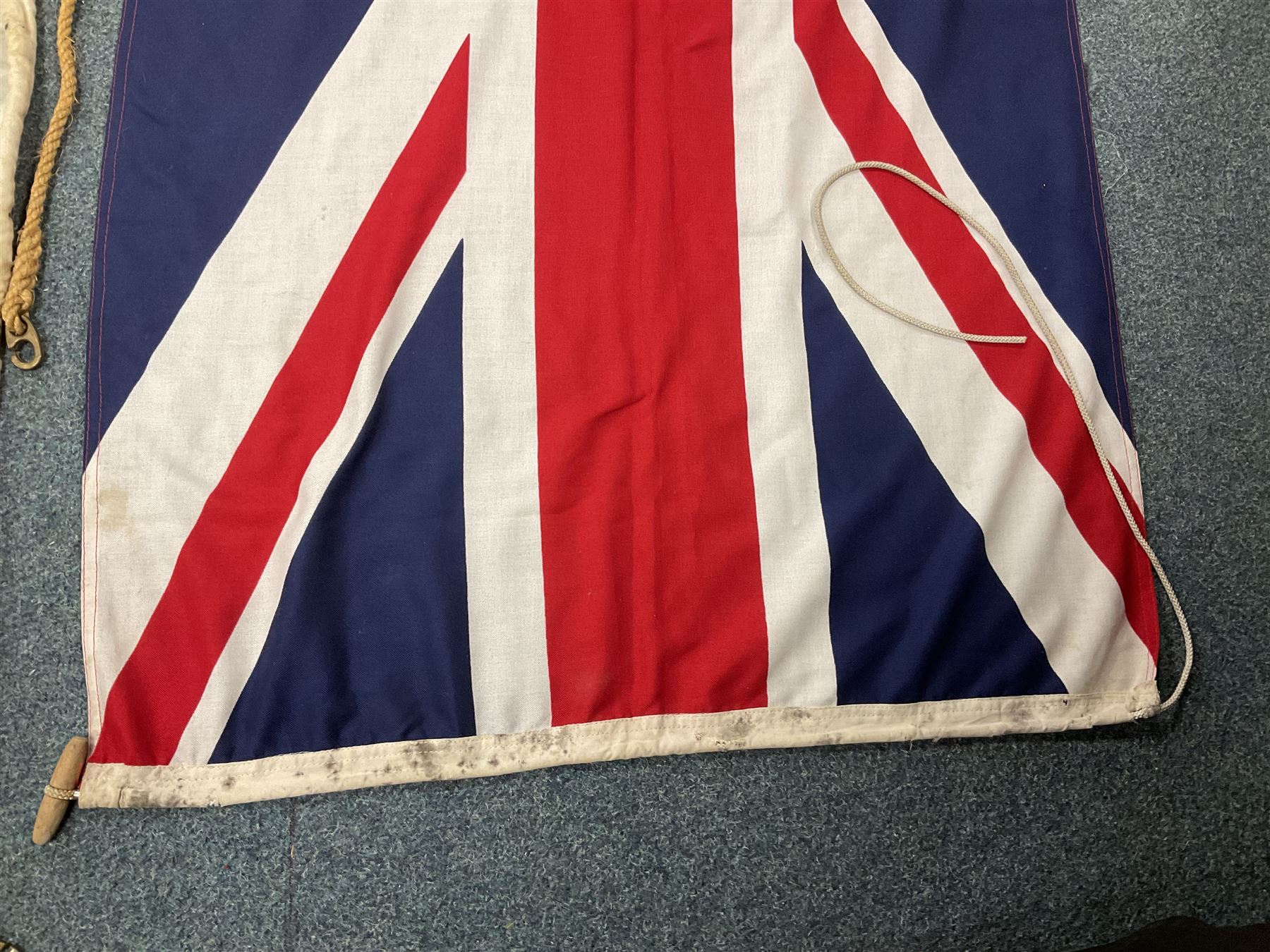 Six flags - White Ensign 180 x 86cm; two Union flags 180 x 86cm and 132 x 62cm; Falklands Islands 153 x 89cm; Yorkshire Rose 153 x 89cm; and QEII 1953 Coronation 84 x 57cm (6)