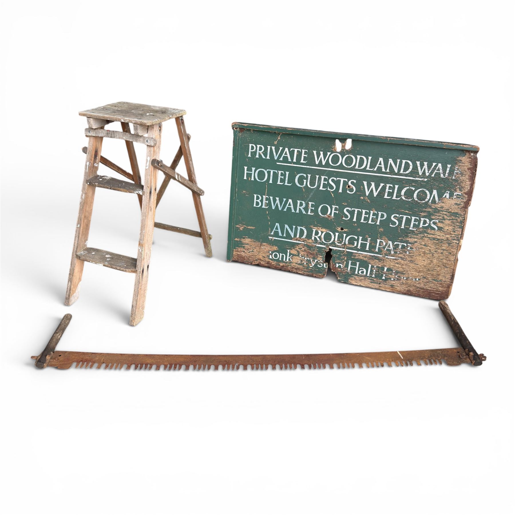 Private woodland walk wooden sign along with large saw and wooden step ladders