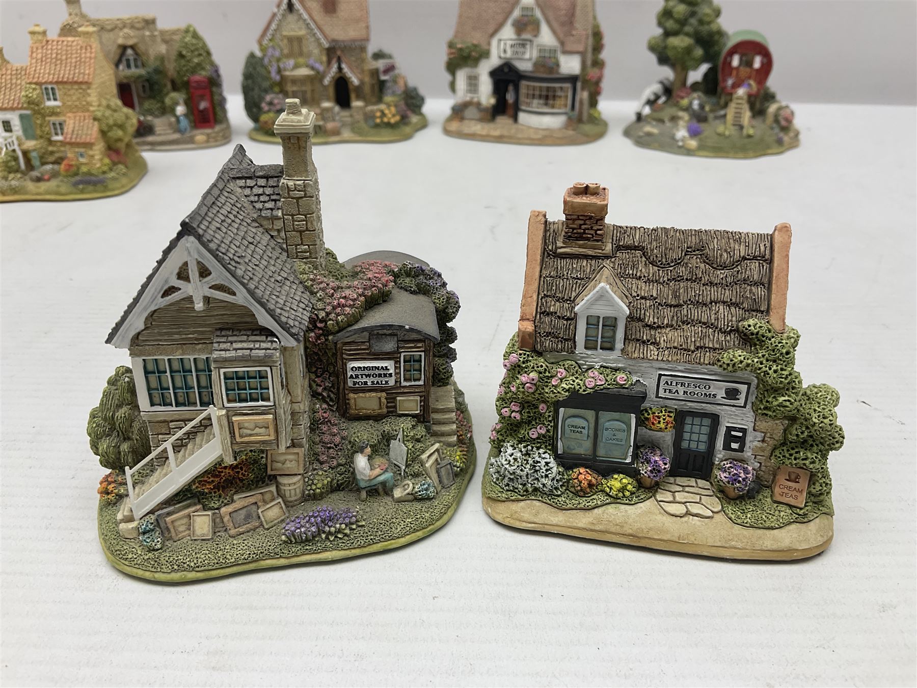 Twenty Lilliput Lanes, including The Right Note, Chatterbox Corner, Whistle Stop Gate, New Neighbours, Travellers Rest etc, all in original boxes