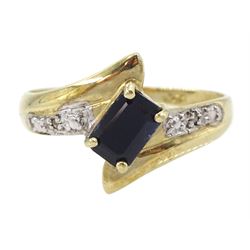 9ct gold emerald cut blue/black stone and diamond cross over ring, hallmarked 