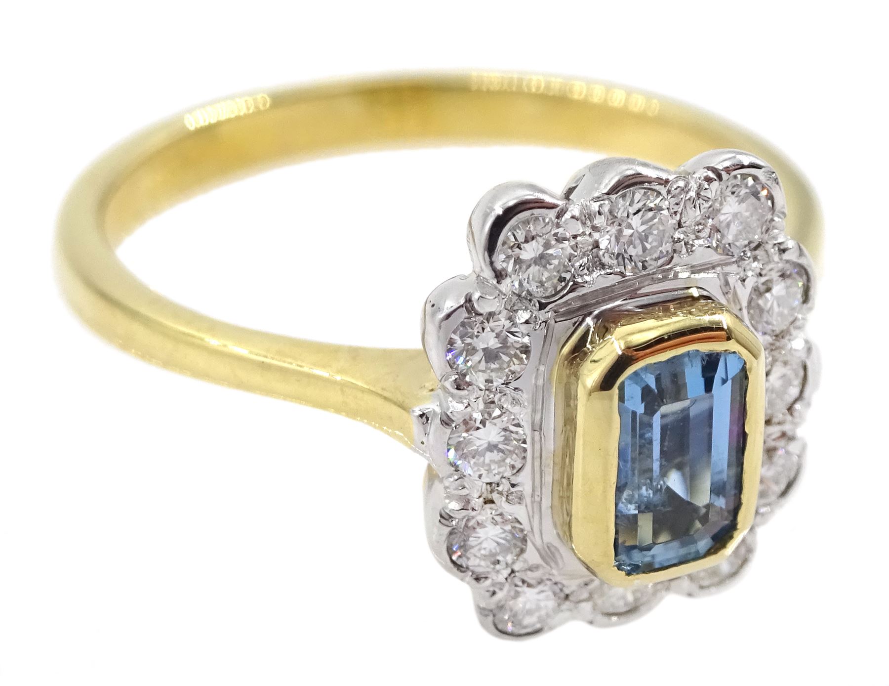 18ct gold emerald cut aquamarine and round brilliant cut diamond cluster ring, hallmarked, aquamarine approx 0..60 carat, total diamond weight approx 0.30 carat