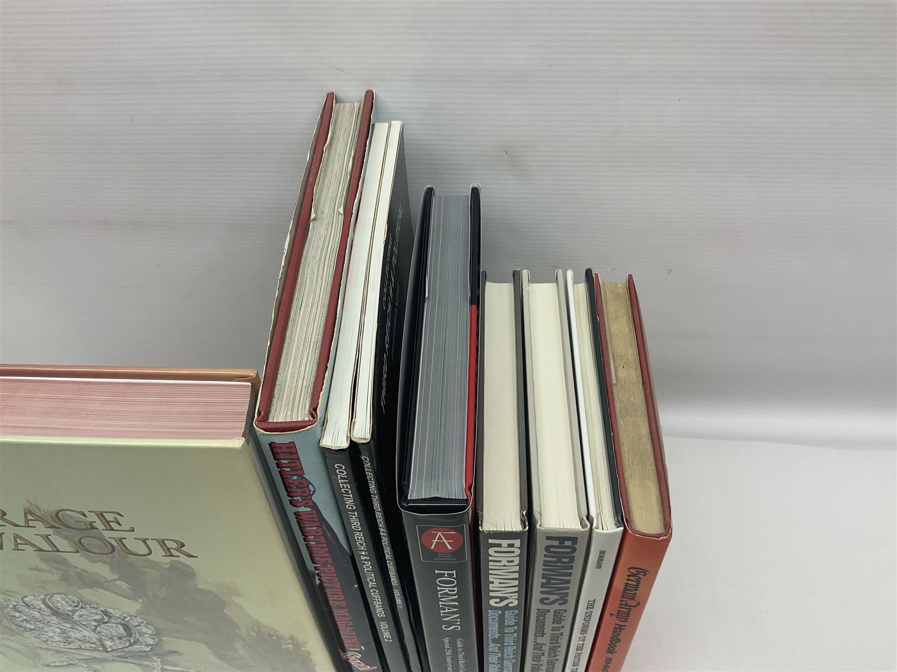 Excellent collection of twelve German Third Reich reference books including four by Adrian Forman - Guide to Third Reich German Awards and Documents, ........ Documents and Their Values. Volumes one and two. Both limited edition and signed by the author; and Bravery, Courage & Valour - Decorations and Awards of the Third Reich; D.E. Bowen: The Prussian & German iron Cross. Signed by the author; Ulric of England: Collecting Third Reich 'SS' and Political Cuffbands. Two volumes; Don Boyle: 'SS' Totenkopf H. Himmler Ring 1933-1945. 2nd printing. Signed by the author and inscribed to 'Adrian' (Forman); and four others (12)
