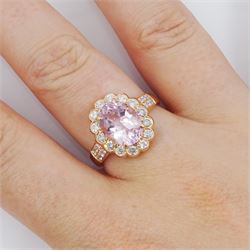 18ct rose gold oval cut morganite and milgrain set, round brilliant cut diamond cluster ring, with diamond set shoulders, stamped 750, morganite approx 2.30 carat, total diamond weight approx 0.65 carat