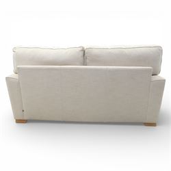 Next Home - Contemporary two seat sofa, square back and arms, upholstered throughout in beige fabric, fitted with two loose seat cushions and two loose back cushions, with arm cushions, raised on block wooden feet