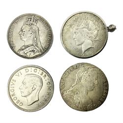Four silver World coins comprising Queen Victoria 1889 crown, King George VI 1937 crown, Marie Thaler 1780 restrike, and mounted United States of America 1928 peace dollar 