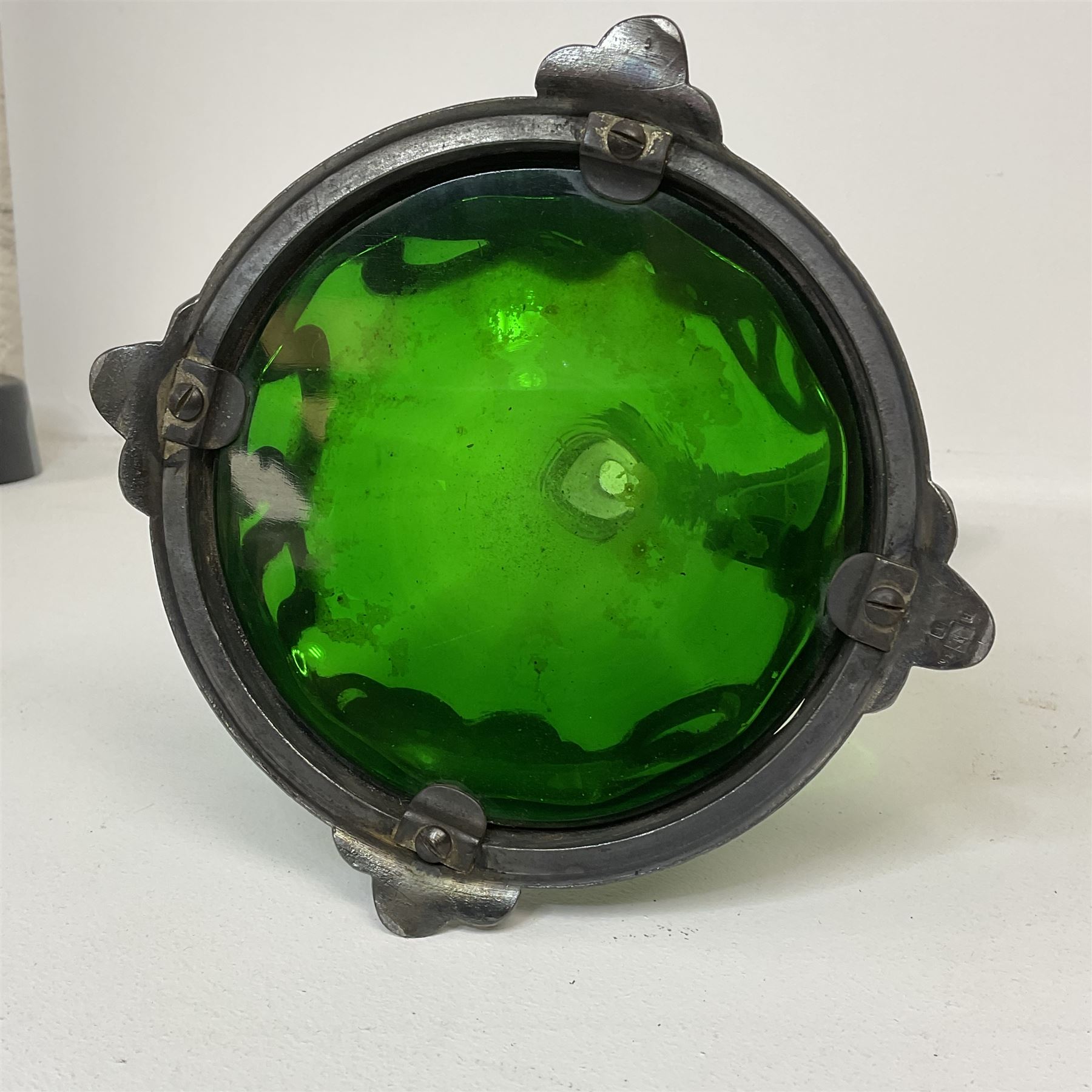 Early 20th century WMF Art Nouveau pewter and green glass ewer, of swept cylindrical form, having a pierced stopper and handle of entwined stems and berry design, the base cast as water nymphs with flowing hair and lily pads, H38cm