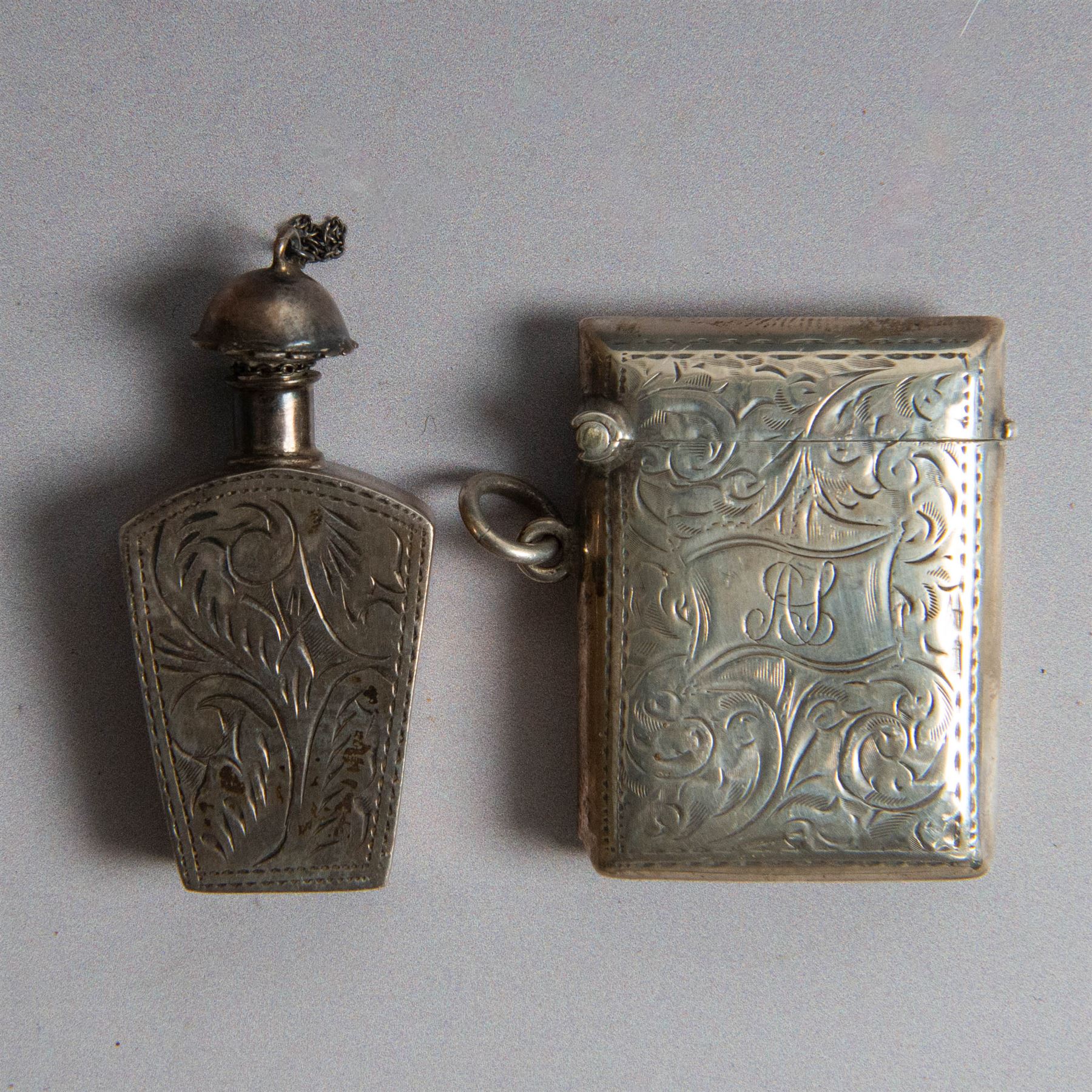 Two silver vesta cases, comprising early 20th century example with engine turned decoration, engraved 'J'espere' (I hope), hallmarked William Neale & Son Ltd, Birmingham 1912 and a small rectangular example with engraved decoration and initials, together with a small silver box, of plain circular form and a small silver scent bottle, all with import marks or A