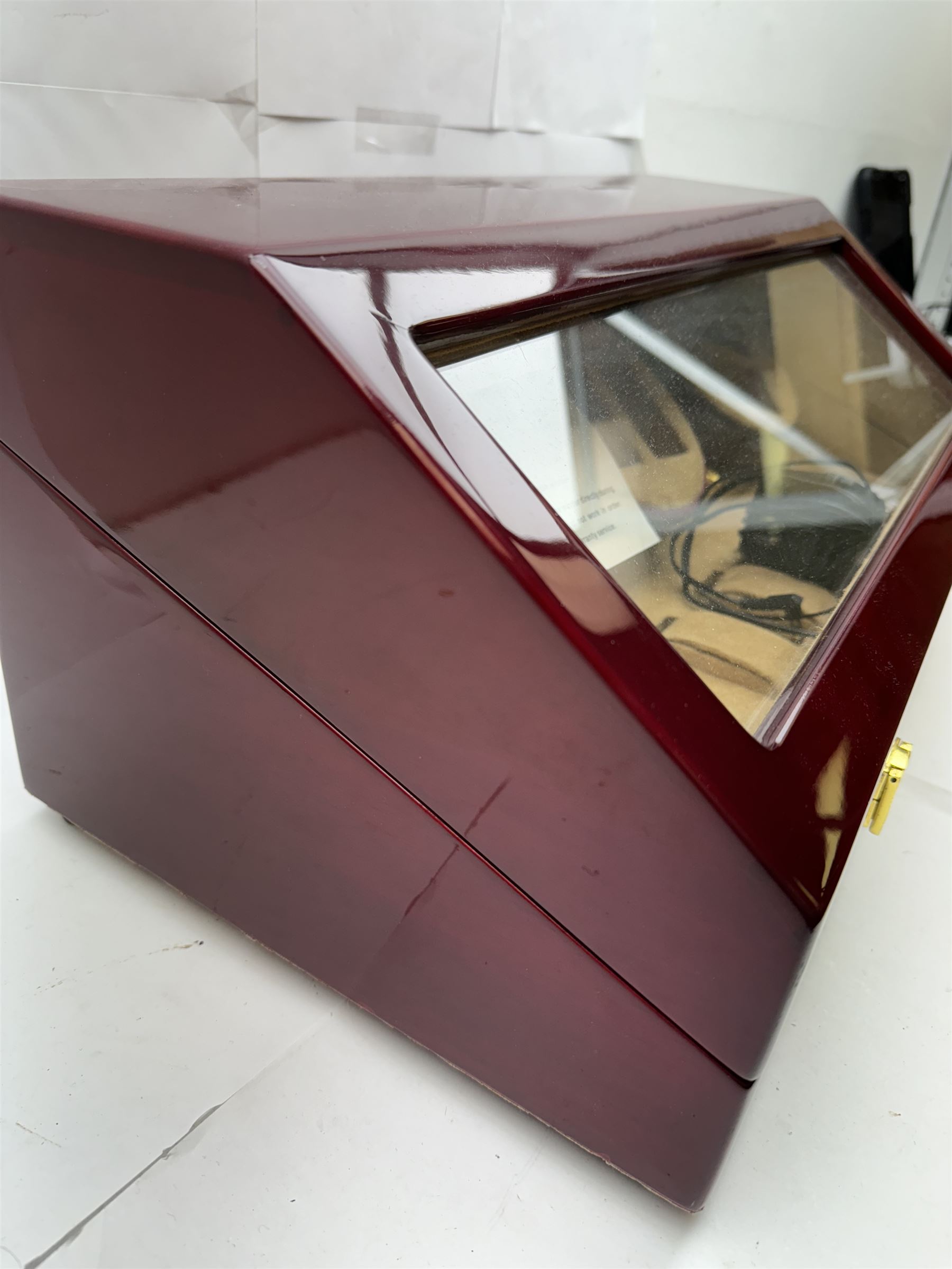 Electronic watch winder for three watches, in laminated mahogany finish, H24cm, W54cm