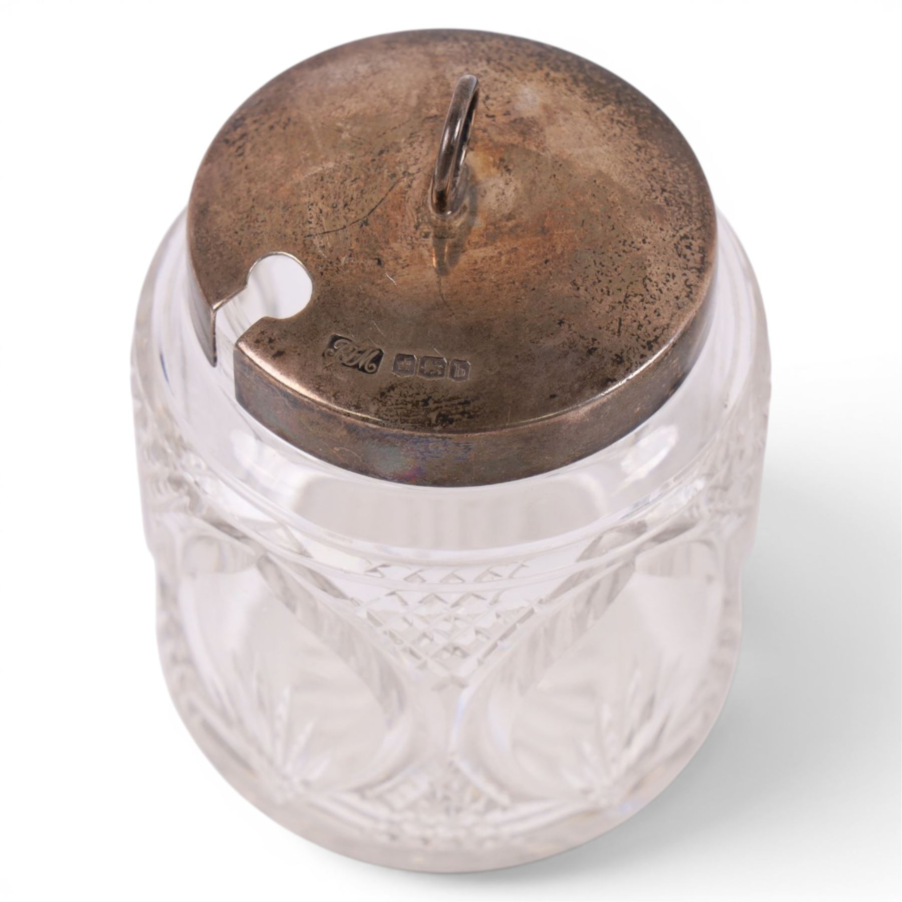 Silver egg cup, pepper shaker and cut glass jar with silver lid, all hallmarked