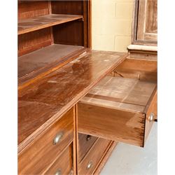 Large mahogany haberdashery cabinet shop fitting, early 20th century and later, the top section fitted with nine shelves, above nine deep drawers sliding out on rollers, on a skirted base. Disassembles for transport. H237cm, L373cm, D95cm.  - COLLECTION BY APPOINTMENT FROM: The White House, Thirsk Road, Easingwold, York, YO61 3NF - CALL 01723 507111 TO ARRANGE